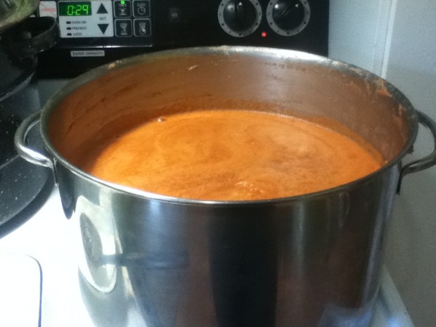 Spiced vinegar, tomatoes (with seeds strained out), salt, sugar and a little cayenne pepper simmer in a big pot. It started this full.