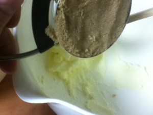 Put the butter and brown sugar into one bowl and smash them together with the back of a wooden spoon. This is called creaming. If your butter is soft and room temperature it's really easy.