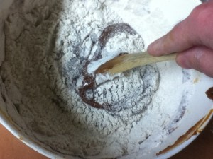 Add the dry ingredients to the wet ingredient slowly, a little at a time.