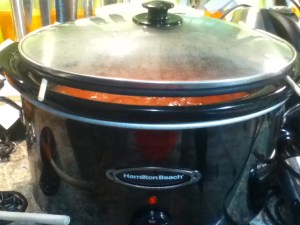 I used chopsticks to elevate the cokker's lid and set the temperature to high. I added just half a cup of brown sugar and a tablespoon of vinegar to offset the astringency. I also added the spices at this point.