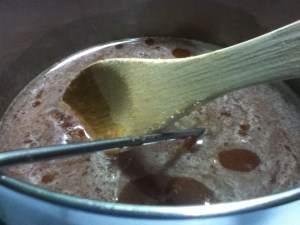 First, the honey gets warm and loose. Note the thermometer probe.