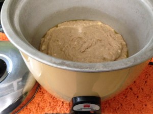I coated the rice cooker pot with a little pan spray and dumped in the batter. And now, we wait.