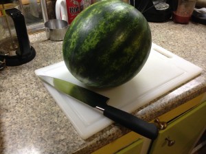 Place that slippy melon on your most stable cutting board. Grab your biggest and sharpest knife.