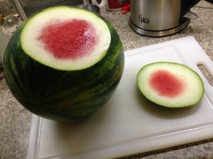 With the utmost care, take a slice off the side of the melon to create a flat surface.