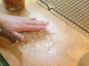 After mixing in two tablespoons of brown sugar, one half teaspoon each cinnamon and vanilla, and six tablespoons of coconut flour I had a nice, stiff dough.  I pinched off little lumps and rolled them in a 2:1 mixture of confectioners' sugar and cinnamon.
