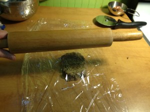The recipe's advice to use layers of plastic wrap or parchment made sense. The dough was much more sticky and crumbly than a typical wheat-based dough. 
